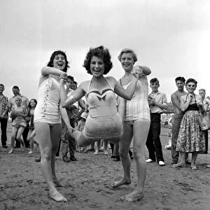 Beauty contest girls at Hunstanton, UK. seen here having some fun on the beach 5th