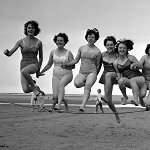 Beauty contest girls jumping a rope on the beach at Redcar. 18th August 1960