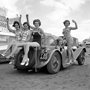 Beauty contest girls playing on the beach at Weston-Super-Mare. 7th September 1960