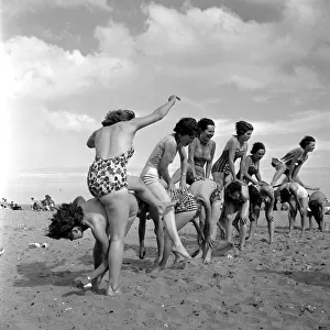 Beauty contest girls playing on the beach at Ramsgate. 31st August 1960