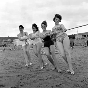 Beauty contest girls playing tug of war on the beach at Weston-Super-Mare