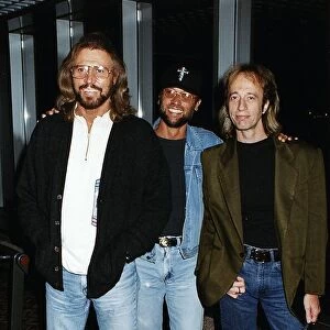 Bee gees Pop Group Brothers Barry Maurice and Robin Gibb arrive at Heathrow from New York