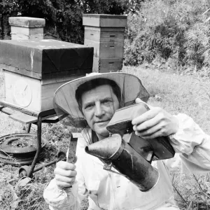 Beekeeper, G Baitey, holding Smoker with heat shield and hook, Newcastle, 22nd July 1971 Beekeeper, G Baitey, holding Smoker with heat shield and hook, Newcastle, 22nd July 1971