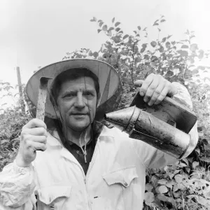 Beekeeper, G Baitey, holding Smoker with heat shield and hook, Newcastle, 22nd July 1971 Beekeeper, G Baitey, holding Smoker with heat shield and hook, Newcastle, 22nd July 1971