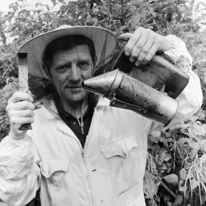 Beekeeper, G Baitey, holding Smoker with heat shield and hook, Newcastle, 22nd July 1971 Beekeeper, G Baitey, holding Smoker with heat shield and hook, Newcastle, 22nd July 1971