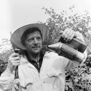 Beekeeper, G Baitey, holding Smoker with heat shield and hook, Newcastle, 22nd July 1971 Beekeeper, G Baitey, holding Smoker with heat shield and hook, Newcastle, 22nd July 1971