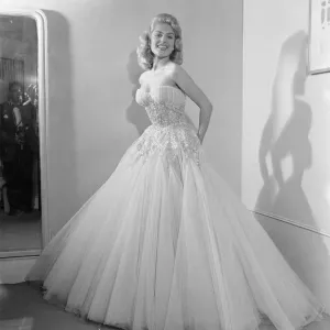 Belinda Lee, British actress tries on dress designed by Julie Harris Belinda Lee, British actress tries on dress designed by Julie Harris