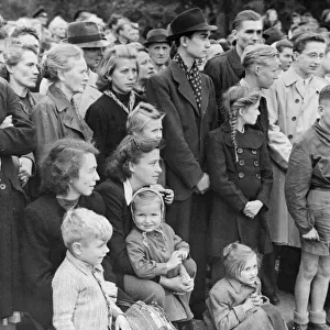 Berlin, Germany under Allied occupation. German civilians watch the entry of British