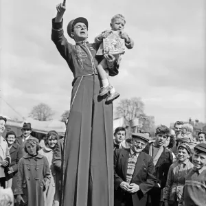 The Bertram Mills Circus comes to town as one worried little boy looks down from the arms
