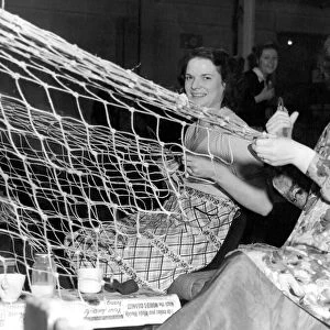 Betty McHugh, 20 and Betty Knaggs, 16, making nets making fishing nets at Richard Irvin