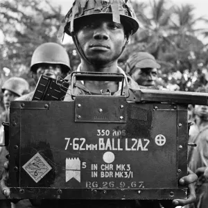 A Biafran soldier seen here holding a box of explosives during the Biafran conflict A Biafran soldier seen here holding a box of explosives during the Biafran conflict