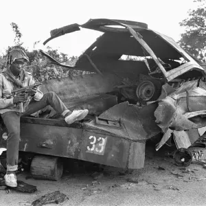 A Biafran soldier seen here sitting on a destroyed Nigerian army armoured personnel A Biafran soldier seen here sitting on a destroyed Nigerian army armoured personnel