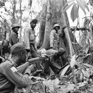Biafran soldiers seen here advancing through the jungle towards the Nigerian army Biafran soldiers seen here advancing through the jungle towards the Nigerian army