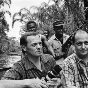 Biafran soldiers seen here crossing the river ina canoe with Daily Herald staff Biafran soldiers seen here crossing the river ina canoe with Daily Herald staff