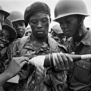 Biafran soldiers seen here inspecting a bomb during the Biafran conflict, 11th June 1968 Biafran soldiers seen here inspecting a bomb during the Biafran conflict, 11th June 1968