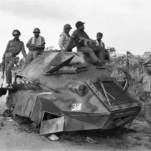 A Biafran soldiers seen here sitting on a destroyed Nigerian army armoured personnel A Biafran soldiers seen here sitting on a destroyed Nigerian army armoured personnel