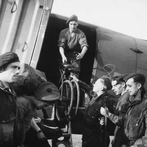 Bicycles being unloaded from an aircraft on the captured aerodrome at Maison Blanche Bicycles being unloaded from an aircraft on the captured aerodrome at Maison Blanche