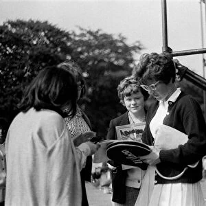 Billie Jean King signs autographs for admirers at the Northern Lawn Tennis Tournament