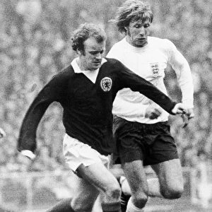 Billy Bremner and Colin Bell clash during the home international between England