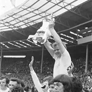 Billy Bremner Leeds United captain is lifted by his team mates with the F. A