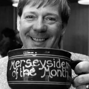 Billy Butler raises a smile and a cup of tea for the Merseyside of the Month competition