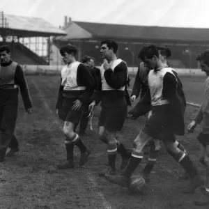 Billy Foulkes (left) leaves the field with some of the Babes who will probably be playing