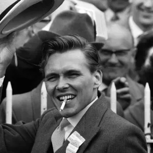 Billy Fury, on Derby Day at the Epsom Races, waving his hat to the crowds. 3rd June 1964
