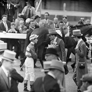 Billy Fury talking to his jockey, on Derby Day at the Epsom Races. 3rd June 1964