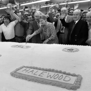 Billy Hughes cuts into the monster birthday cake to celebrate Fords 25th birthday Billy Hughes cuts into the monster birthday cake to celebrate Fords 25th birthday