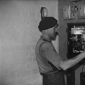 Bilston Pottery 1958 A worker inspects the controls for the electrical operated
