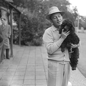 Bing Crosby holding a Poodle Sept 1952 A©Mirrorpix