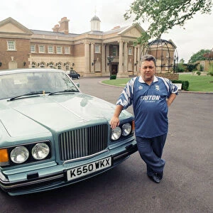 Birmingham City chairman David Sullivan pictured beside his Bently car at his home