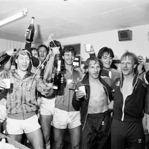 Birmingham City players celebrate with champagne in the dressing room after they clinched Birmingham City players celebrate with champagne in the dressing room after they clinched