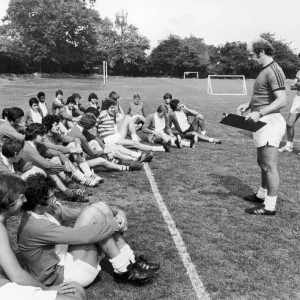 Birmingham City players listen to instructions from manager Jim Smith during a pre season