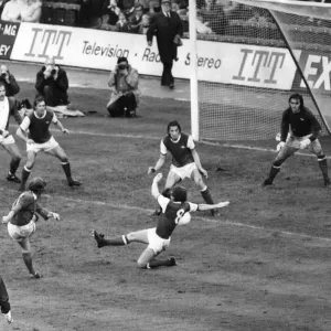 Birmingham Citys Gordon Taylor fires at the arsenal Goal despite a tackle from Alan
