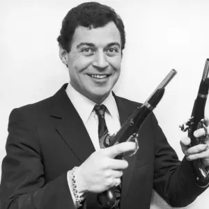 Birmingham Comedian, David Ismay seen posing with a gun in either hand Birmingham Comedian, David Ismay seen posing with a gun in either hand