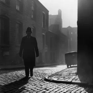 Birmingham Emergency Services. A police officer walking on the beat in the early Birmingham Emergency Services. A police officer walking on the beat in the early