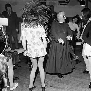 The Bishop of Durham, Dr. Ian Ramsey, dancing with fifteen-year-old Isobel Brennan