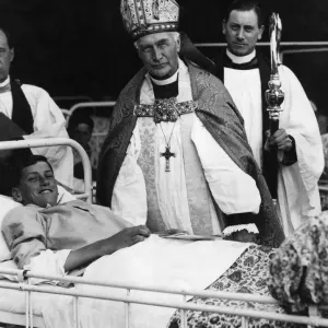 Bishop of London, Arthur Foley Winnington-Ingram, confirms one of a number of boys Bishop of London, Arthur Foley Winnington-Ingram, confirms one of a number of boys