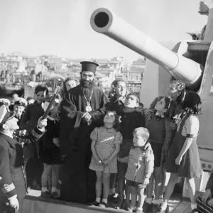 The Bishop of Piraeus with Commander Foster-Brown of the Royal Navy pictured with a group The Bishop of Piraeus with Commander Foster-Brown of the Royal Navy pictured with a group