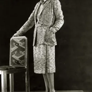 Black and Yellow flecked tweed sports suit - March 1931 The jumper is of yellow Black and Yellow flecked tweed sports suit - March 1931 The jumper is of yellow