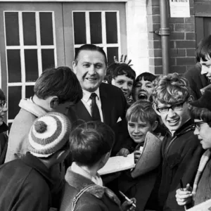 Former Blackpool footballer and current manager Stanley Mortensen surrounded by young Former Blackpool footballer and current manager Stanley Mortensen surrounded by young