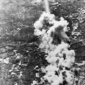 Blasting the road to Messina. Cluster of bombs bursts directly on the main road of