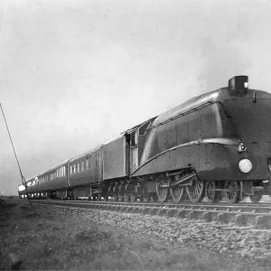 In a blinding rainstorm the Silver Jubilee engine Silver Link thunders along near In a blinding rainstorm the Silver Jubilee engine Silver Link thunders along near