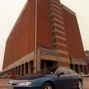 BLUE PEUGEOT 406 COUPE CAR AUGUST 1997 IN FRONT OF BUILDING BLUE PEUGEOT 406 COUPE CAR AUGUST 1997 IN FRONT OF BUILDING