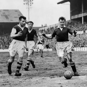 Blunstone (right) the Chelsea outside left, dribbles the ball past Rudman Blunstone (right) the Chelsea outside left, dribbles the ball past Rudman