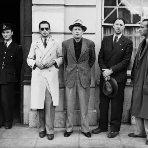 One of the BOAC flying boat crew poses with passengers at Poole police station where