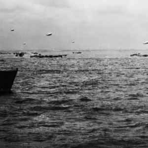 On board H. M.s Soylla, Admiral Vian with LCTs off the beach with balloons in the air On board H. M.s Soylla, Admiral Vian with LCTs off the beach with balloons in the air