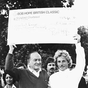 Bob Hope with Bernhard Langer handing over cheque