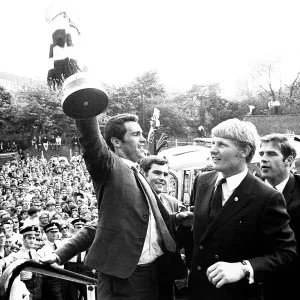 Bob Moncur holds the Inter-Cities Fairs Cup aloft at St James